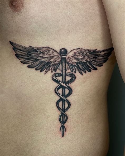 superior caduceus tattoos.